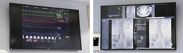 テーブル前後の壁面にも大型液晶モニタを設置